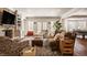 Spacious living room with ample seating, fireplace and hardwood floors at 7341 Washington Blvd, Indianapolis, IN 46240