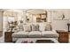 Comfortable living room featuring a plush sofa and view into the bright kitchen at 7341 Washington Blvd, Indianapolis, IN 46240