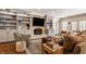 Cozy living room with fireplace, built-in shelving and comfortable seating at 7341 Washington Blvd, Indianapolis, IN 46240