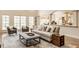 Spacious living area with abundant natural light and a seamless flow into the adjacent kitchen at 7341 Washington Blvd, Indianapolis, IN 46240