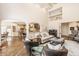 Elegant living room with high ceilings and an open layout leading to a modern kitchen at 7341 Washington Blvd, Indianapolis, IN 46240