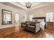 Elegant main bedroom with sitting area, hardwood floors, and a luxurious ambiance at 7341 Washington Blvd, Indianapolis, IN 46240
