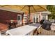 Covered outdoor deck with dining table and chairs at 7341 Washington Blvd, Indianapolis, IN 46240