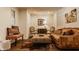 Cozy sitting room displays unique decor, hardwood floors, and comfortable furniture arrangement at 7341 Washington Blvd, Indianapolis, IN 46240