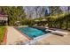 Private swimming pool with diving board, surrounded by a lush, green landscape at 7341 Washington Blvd, Indianapolis, IN 46240