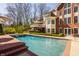 Beautiful swimming pool area with adjacent seating and a well-manicured lawn at 7341 Washington Blvd, Indianapolis, IN 46240