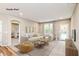Finished basement with comfortable sitting area, large TV, and access to backyard at 10349 Gateway Dr, Brownsburg, IN 46234