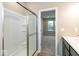 Bathroom with walk-in shower and double vanity at 10349 Gateway Dr, Brownsburg, IN 46234