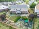 Backyard with garden, playset, and screened porch at 10723 Pokagon Way, Indianapolis, IN 46239