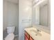 Clean bathroom with a single sink vanity and toilet at 10723 Pokagon Way, Indianapolis, IN 46239