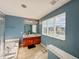 Modern bathroom with double vanity, soaking tub, and large window at 10723 Pokagon Way, Indianapolis, IN 46239