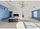 Spacious bedroom with blue walls and a large window, offering ample natural light at 10723 Pokagon Way, Indianapolis, IN 46239