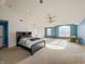 Large main bedroom with a king-size bed, sitting area and a vaulted ceiling at 10723 Pokagon Way, Indianapolis, IN 46239
