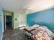 Bedroom with a white metal bed frame, colorful bedding, and a ceiling fan at 10723 Pokagon Way, Indianapolis, IN 46239