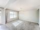 Bright dining room with chandelier and grey carpet at 10723 Pokagon Way, Indianapolis, IN 46239