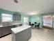 Modern kitchen with grey cabinets and eat-in area at 10723 Pokagon Way, Indianapolis, IN 46239