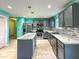 Modern kitchen with grey cabinets, marble countertops, and stainless steel appliances at 10723 Pokagon Way, Indianapolis, IN 46239