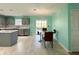Modern kitchen with grey cabinets and eat-in area with deck access at 10723 Pokagon Way, Indianapolis, IN 46239
