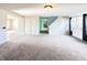 Spacious living room with carpeting and views into adjacent rooms at 10723 Pokagon Way, Indianapolis, IN 46239