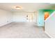 Open living room with carpet and view of entryway and stairs at 10723 Pokagon Way, Indianapolis, IN 46239