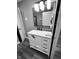 Updated bathroom with white vanity and marble shower at 1243 W 19Th St, Indianapolis, IN 46202