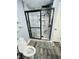 Modern bathroom with marble-tiled shower and grey flooring at 1243 W 19Th St, Indianapolis, IN 46202