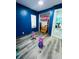 Blue bedroom with wood-look floors and closet at 1243 W 19Th St, Indianapolis, IN 46202