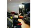 A cluttered living room with a hammock and various items at 1243 W 19Th St, Indianapolis, IN 46202