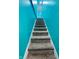 Gray carpeted stairs with teal walls at 1243 W 19Th St, Indianapolis, IN 46202