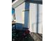 Grey storage shed with white door and gravel ground at 1243 W 19Th St, Indianapolis, IN 46202