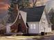 Charming home featuring a brick and siding exterior, complemented by a well-manicured lawn and cozy front porch seating area at 2029 W 60Th St, Indianapolis, IN 46228