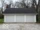 A detached three-car garage provides ample parking and storage space at 2029 W 60Th St, Indianapolis, IN 46228