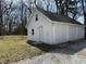 Detached two-car garage with lawn and plenty of driveway parking at 2029 W 60Th St, Indianapolis, IN 46228
