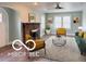 Bright living room with a decorative fireplace, modern furniture, large windows, and an open floor plan at 2029 W 60Th St, Indianapolis, IN 46228