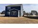 Angle view of home's backyard with sunroom under a partly cloudy sky at 2322 Dixon Creek Dr, Whitestown, IN 46075