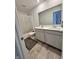 Modern bathroom with dual sinks, white cabinets, and tile flooring for a clean, stylish look at 2322 Dixon Creek Dr, Whitestown, IN 46075