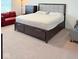 Bedroom with a queen sized bed and a big dark-wood dresser at 2322 Dixon Creek Dr, Whitestown, IN 46075