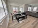 Open dining area with hardwood floors and views of the front yard at 2322 Dixon Creek Dr, Whitestown, IN 46075