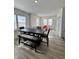 Open dining area with hardwood floors and views of the front yard at 2322 Dixon Creek Dr, Whitestown, IN 46075