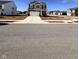 Residential street view showcases a well-maintained home with a spacious front yard at 2322 Dixon Creek Dr, Whitestown, IN 46075