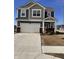 Charming two-story home features a two-car garage, blue siding, and a welcoming front porch at 2322 Dixon Creek Dr, Whitestown, IN 46075