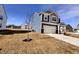 Well-maintained two-story home with blue siding and a spacious front yard at 2322 Dixon Creek Dr, Whitestown, IN 46075