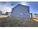 Blue two-story house with a well-maintained lawn and modern architectural details at 2322 Dixon Creek Dr, Whitestown, IN 46075