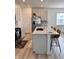 Modern kitchen features a granite countertop island and stainless steel appliances at 2322 Dixon Creek Dr, Whitestown, IN 46075