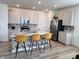 Modern kitchen with stainless steel appliances, granite countertops, and a breakfast bar at 2322 Dixon Creek Dr, Whitestown, IN 46075
