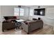Comfortable living room with a sectional sofa, patterned rug, and a large TV at 2322 Dixon Creek Dr, Whitestown, IN 46075