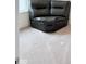 Cozy living area featuring comfortable gray leather seating, perfect for relaxing by the window at 2322 Dixon Creek Dr, Whitestown, IN 46075
