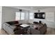 Bright living room with a gray sectional, large windows, and a mounted TV at 2322 Dixon Creek Dr, Whitestown, IN 46075