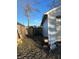 Backyard with wooden fence, shed, and leaf covered ground at 3128 S Holt Rd, Indianapolis, IN 46221