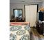 Bedroom with double bed, dresser, and mirrored closet at 3128 S Holt Rd, Indianapolis, IN 46221